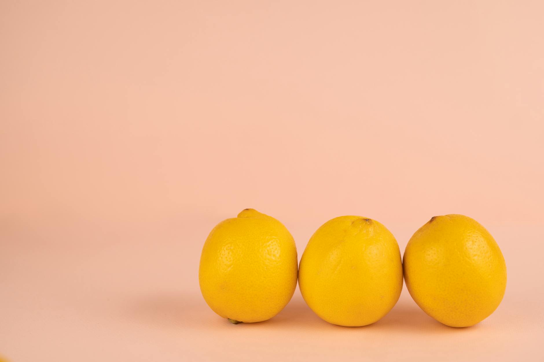 Bright lemons on a yellow background symbolizing restoration and vitality during difficult times